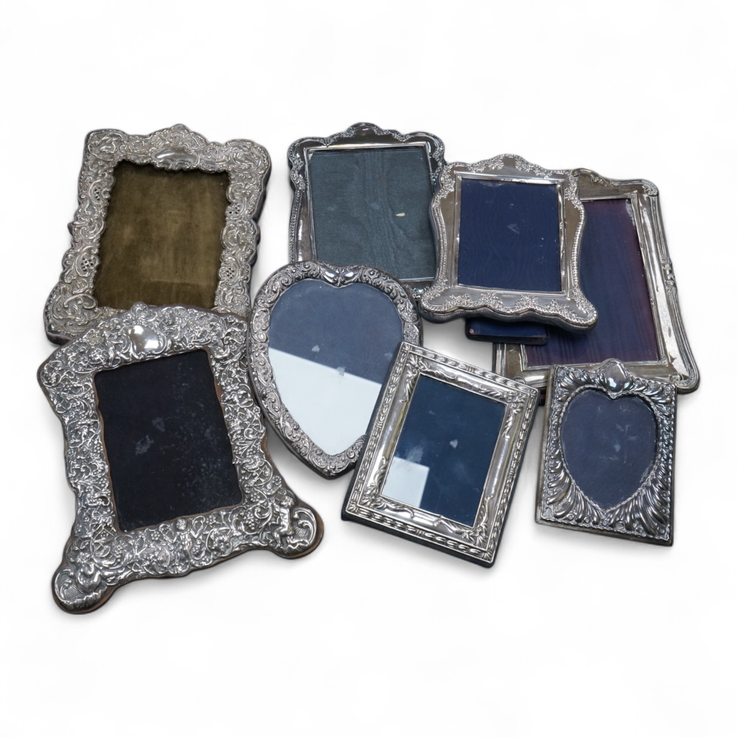 Eight assorted modern silver or sterling mounted photograph frames, including Britannia standard with heart shaped aperture, by CSR Ltd, London, 1981, 12.5cm.